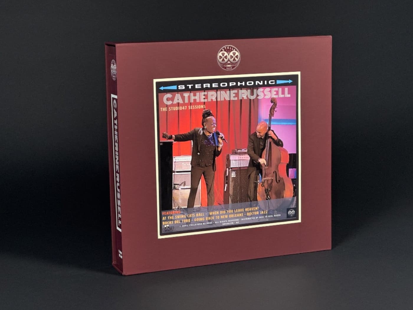 Catherine Russell Studio47 Sessions burgundy album box featuring live performance photo with bassist